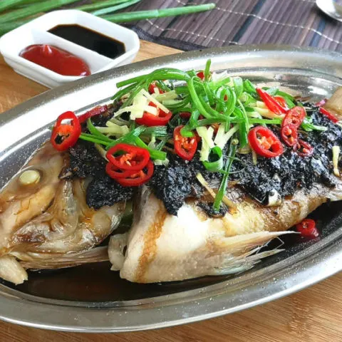 Steamed fish with black bean sauce 清蒸豆豉魚 is a traditional Chinese style cuisine popular among the Cantonese. This article explains all the right steps to prepare this dish in the traditional Cantonese way.