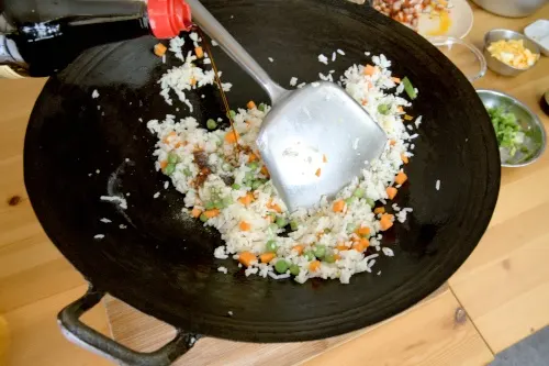 Season the rice over low heat