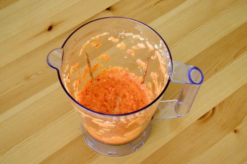 Blend the onions, chili, and garlic with water until it becomes a paste.