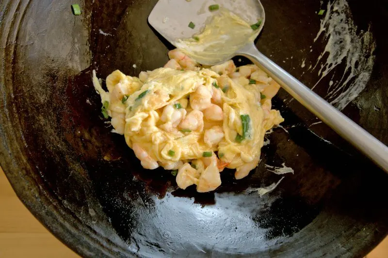 Combine the cooked shrimp with the egg