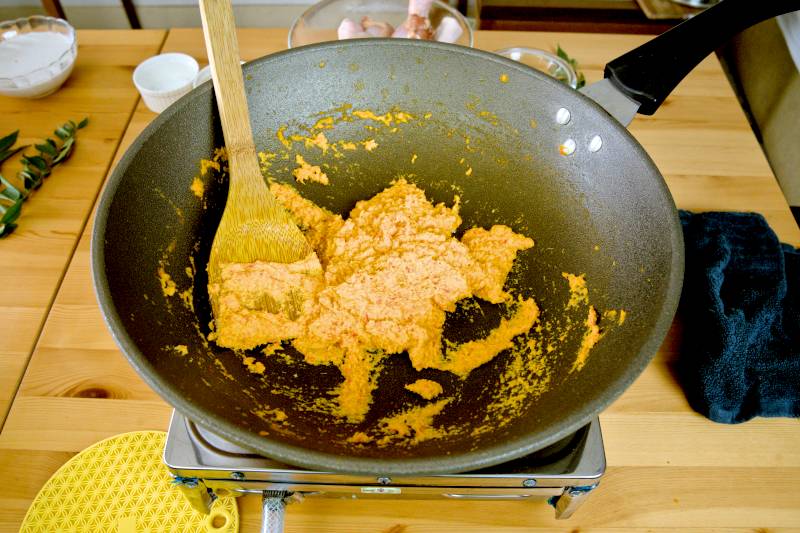 Saute the curry paste until dry and the oil starts to separate from the ingredients.