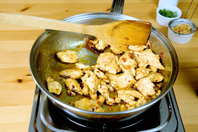 Return the fried chicken to the pan to combine with the sauce