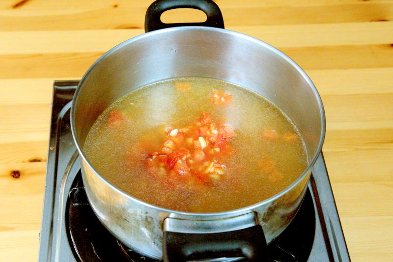 boil the tomto with the stock