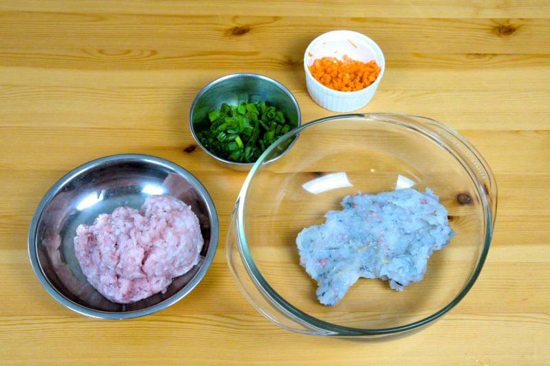 Mix the shrimp paste and cubes with chopped green onion, diced carrot, and minced pork or fish paste.