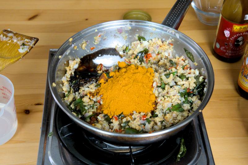 stir in the curry powder, oyster sauce, light soy sauce, sugar, and the dark soy sauce.