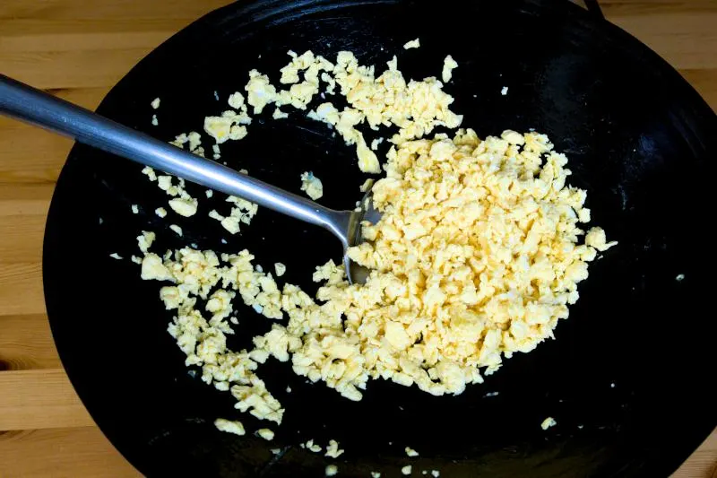 use the wok spatula to break them into small pieces.