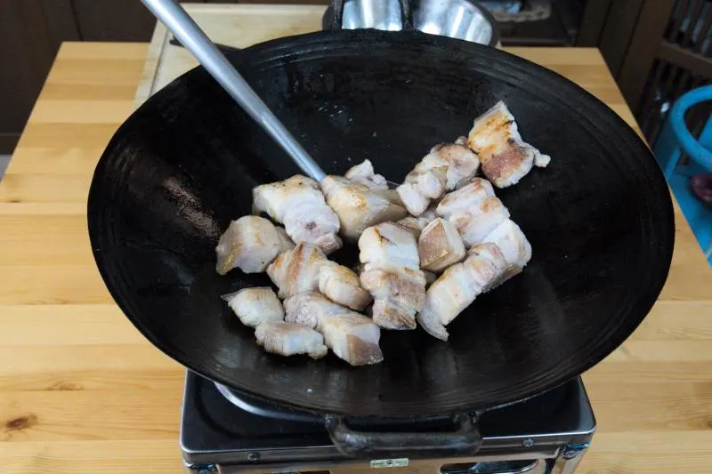 Browning the pork before braising