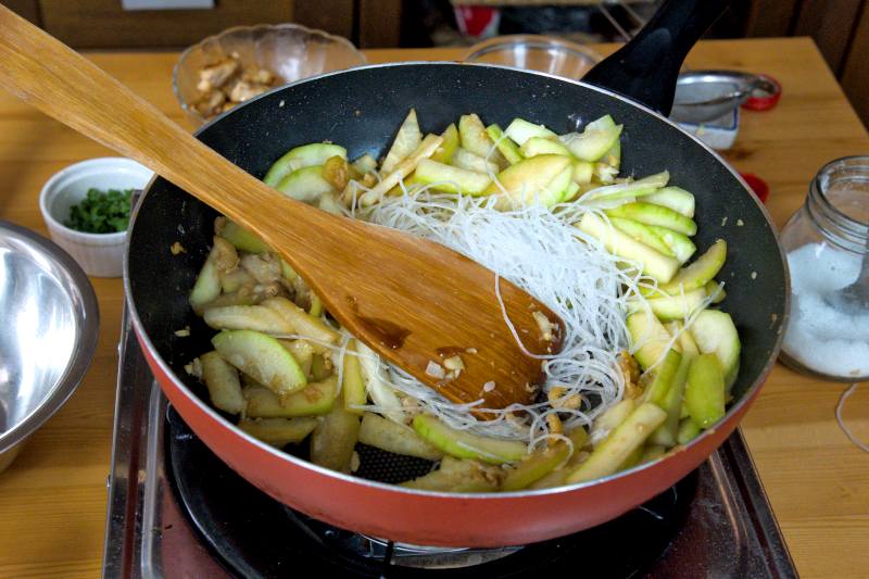 Add the glass noodles and a bit of water to cook it until soft